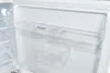 Interior of a white refrigerator with transparent shelves. Produktbild-Vorschau