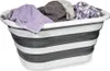 A collapsible laundry basket filled with folded towels and clothes. Voir les images du produit