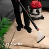 A person is using a wet vacuum cleaner on a beige carpet in a living room setting. Náhľad obrázku produktu