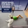A person and a dog relaxing on the floor in a modern living space with a fireplace in the background. Produktbild-Vorschau