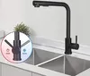 A black kitchen faucet with a pull-out spray head is shown installed over a double sink. A circular graphic overlay highlights the hot and cold water controls. Produktbild-Vorschau