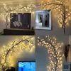 Collage of four images showing illuminated willow branches used as wall decoration in different room settings. Produktbild-Vorschau