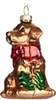 A glass ornament of a golden retriever dog wearing a red scarf and green holly leaves. Náhled obrázku produktu