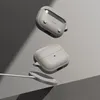 Two gray earbud cases and a charging puck are shown floating against a gray background. Produktbild-Vorschau