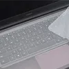 A close-up view of a laptop keyboard with a transparent keyboard cover partially applied. Produktbild-Vorschau