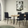 A dining room scene with a wooden table and black velvet chairs. Produktbild-Vorschau