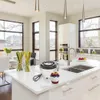 A modern kitchen island with a mixing bowl and fruit. Anteprima dell’immagine prodotto