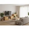 A modern living room with a wooden TV stand, sofa, and coffee table. Produktbild-Vorschau