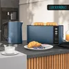 A modern kitchen scene featuring a blue toaster with bread, a blue kettle with steam, and breakfast items including a croissant and coffee. Produktbild-Vorschau