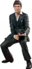 A figure of Tony Montana from Scarface is shown in a crouched pose, holding a gun. Podgląd zdjęcia produktu