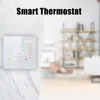 A smart thermostat is shown on a marble wall, with a blurred background of a room with shelves. Podgląd zdjęcia produktu