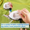 A hand is using a mini iron on a green t-shirt with a fairy patch. Produktbild-Vorschau