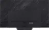 The back of a black LG OLED TV is shown, mounted on a stand. The TV is against a dark, patterned background that resembles stone or marble. Produktbild-Vorschau