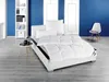 A bedroom scene with a bed, bookshelf, and chair.