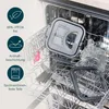 Various parts of a deep fryer and fondue pot are placed inside a dishwasher rack. Produktbild-Vorschau