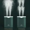 Two humidifiers are shown side-by-side, demonstrating continuous and interval spraying modes. Náhľad obrázku produktu