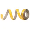 A roll of self-adhesive tape, unspooling in a wavy shape against a white background. Produktbild-Vorschau