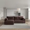 A modern living room with a sectional sofa in front of a kitchen area. Produktbild-Vorschau