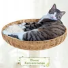 A cat is relaxing in a wicker basket on top of a cat tree. Podgląd zdjęcia produktu