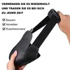 A hand holding a black steel toe cap overshoe. Produktbild-Vorschau