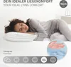 A woman sleeping on a bed with a pillow, illustrating ideal lying comfort. Produktbild-Vorschau
