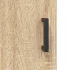 A close-up of a wooden cabinet door with a black handle. Produktbild-Vorschau