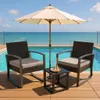Two rocking chairs and a small table are set up on a wooden deck next to a swimming pool, with an umbrella providing shade. Produktbild-Vorschau