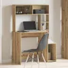 A desk with a laptop and a chair in a room. Náhled obrázku produktu