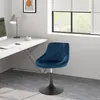 A blue velvet bar stool with a diamond-stitched pattern is placed in a home office setting next to a desk. Náhľad obrázku produktu