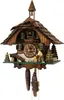 A traditional wooden cuckoo clock with a carved figure of a woodcutter. Anteprima dell’immagine prodotto