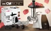 A Clatronic meat grinder is shown with its packaging and accessories, surrounded by pieces of raw meat. Náhľad obrázku produktu