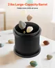 Rocks falling into a black tumbler on a white table. Anteprima dell’immagine prodotto