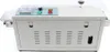 A front view of a white and gray sealing machine on a white background. Náhled obrázku produktu