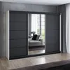 A modern sliding door wardrobe with mirrored doors reflects a living room setting. Produktbild-Vorschau