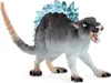 A toy figure of a creature with blue crystalline spikes on its back, standing on a white background. Voir les images du produit