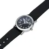 A close-up shot of a black children's watch with a silver casing and a black fabric strap, set against a white background. Produktbild-Vorschau