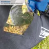 Close-up of a leaf blower bag with debris inside, showing a transparent window and a logo. Produktbild-Vorschau