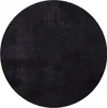 A black circular rug shown from a top-down perspective.