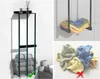 A collage of images showing a black stainless steel towel rack with towels and bathroom accessories. Produktbild-Vorschau