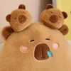Close-up of a plush toy bear's face with two smaller bear heads on top. Anteprima dell’immagine prodotto