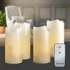 Four LED candles and a remote control are displayed in a living room setting. Produktbild-Vorschau