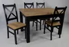A dining set with a wooden table and four black chairs with wooden seats. Náhled obrázku produktu
