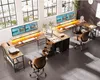 A modern office space with a large, L-shaped desk setup. Anteprima dell’immagine prodotto