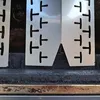A close-up view of metal heat shields with cutouts. Produktbild-Vorschau