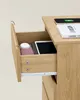 A partially opened wooden drawer of a nightstand, revealing its contents and structure. Náhled obrázku produktu