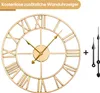 A gold-colored wall clock with Roman numerals and three black clock hands, along with a plus sign, are displayed against a white background. Voir les images du produit