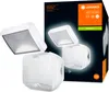 A product box for a white LED outdoor spotlight with a motion sensor, shown with the product itself in front of the box. Produktbild-Vorschau