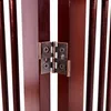 A close-up view of the hinges connecting two wooden panels of a pet gate. Produktbild-Vorschau