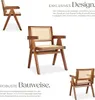 A collage of images showcasing a wooden armchair with cane weaving, accompanied by descriptive text about its design and construction. Produktbild-Vorschau