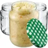 Three glass jars, one filled with sauerkraut, and a green and white checkered lid are arranged against a white background. Anteprima dell’immagine prodotto